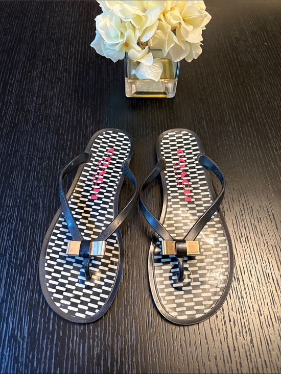 Coach Shoes - Coach Black Flip Flops with Gold Bow Detail